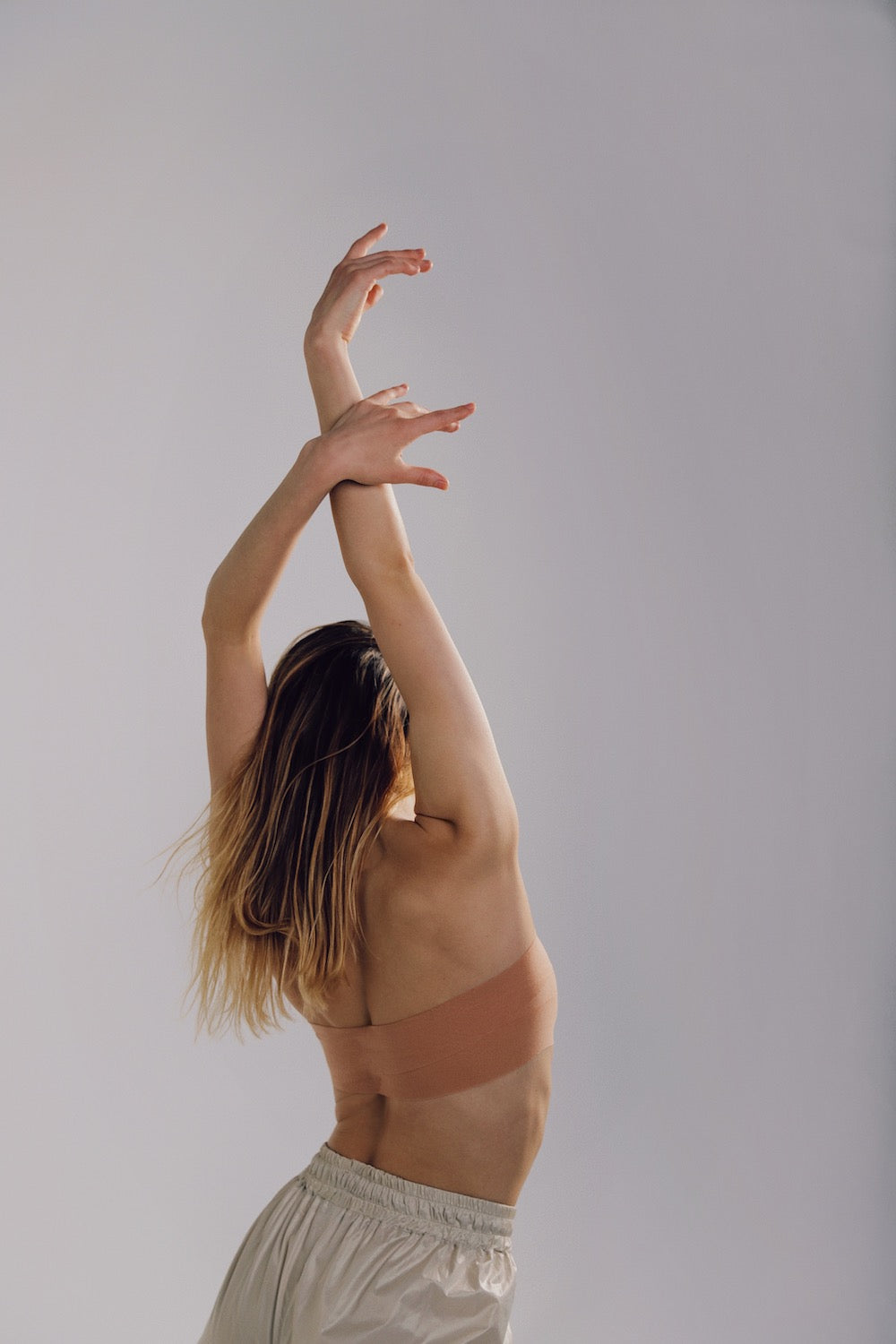 Breast - shaping adhesive band